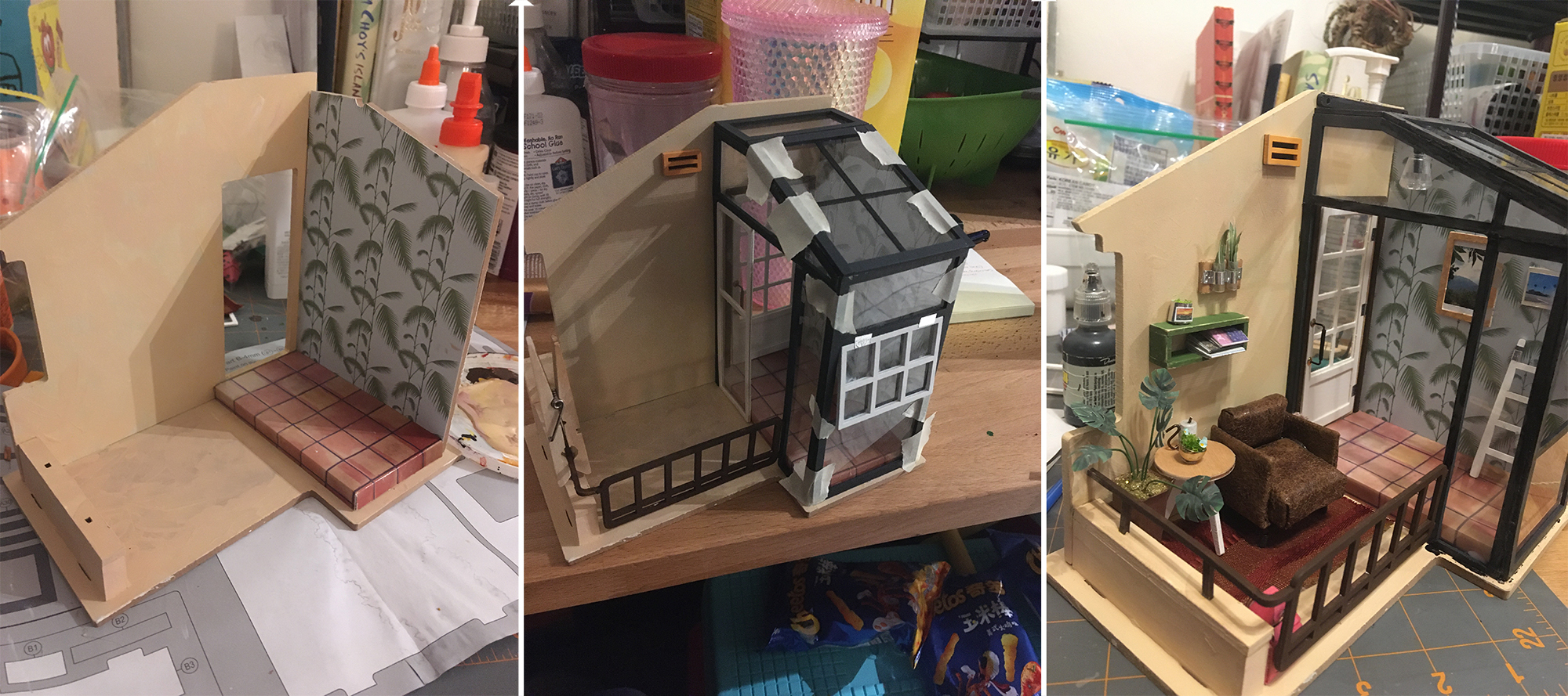 A series of three photos of a miniature scene being put together. From the left to right is a progression of an empty peach-stucco coloured patio shell with a raised tile area and palm tree wallpaper decorative wall, then the addition of faux black-framed glass walls forming an atrium, and finally a view from a slightly different angle showing accessories like plants and furniture added to the patio area.