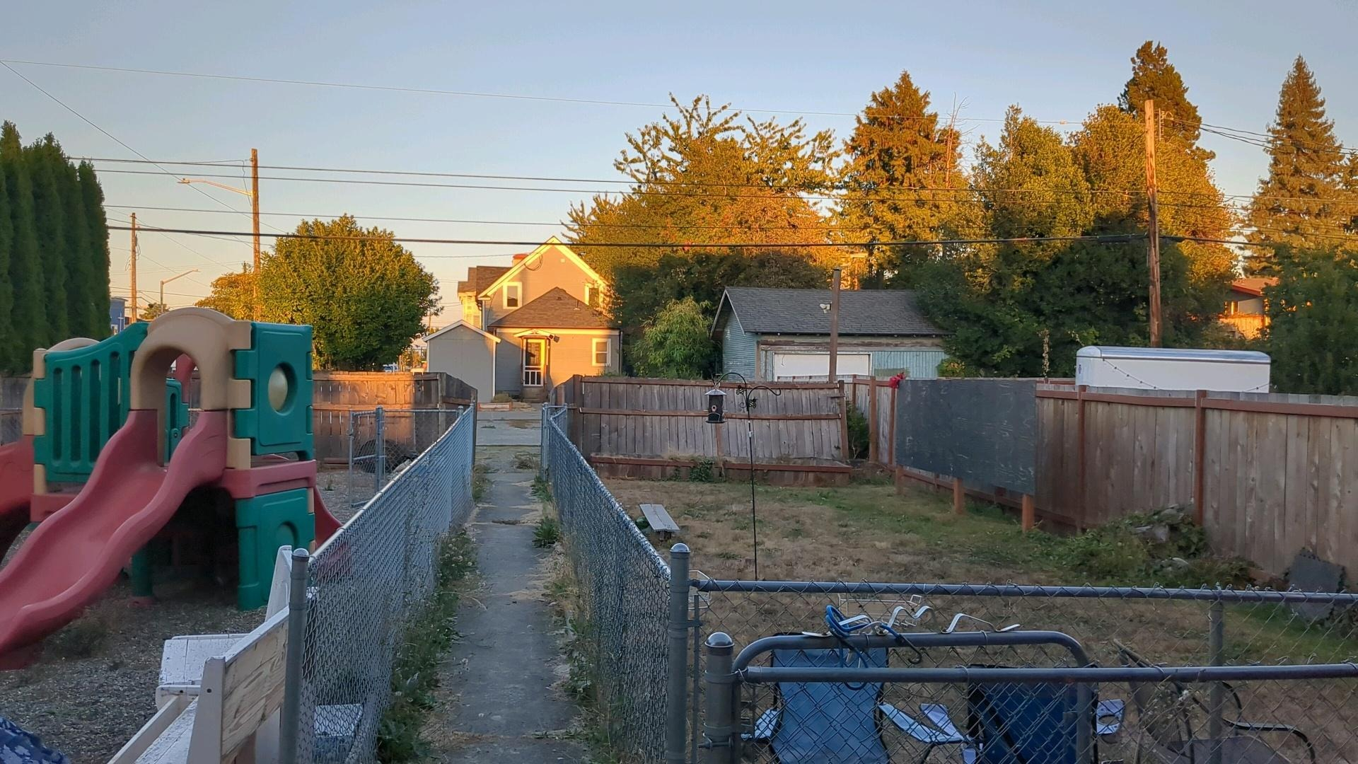 backyard of the space, featuring a currently unused small daycare playground