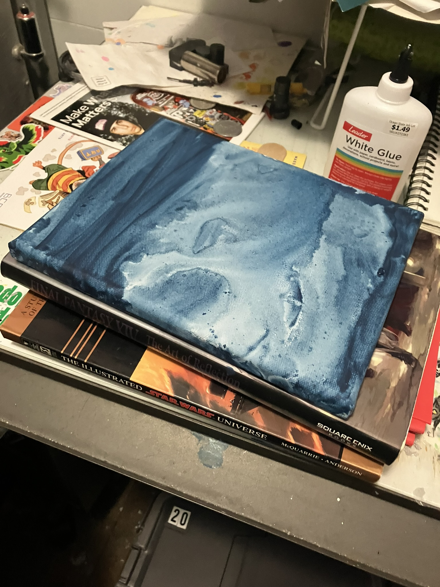 a midsized canvas that's been washed in dark blue