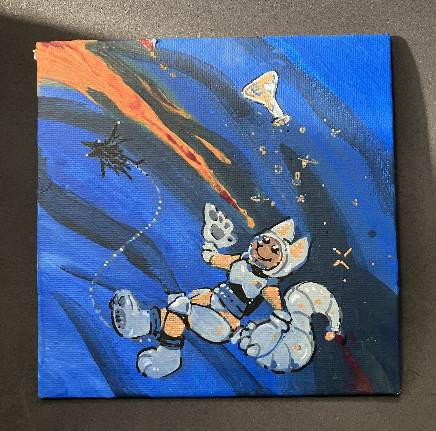 [photo]a small square canvas painted mostly in orange and blue. a little nondescript anthro in a space suit is floating and releasing a beaker of sparkling stuff into the atmosphere