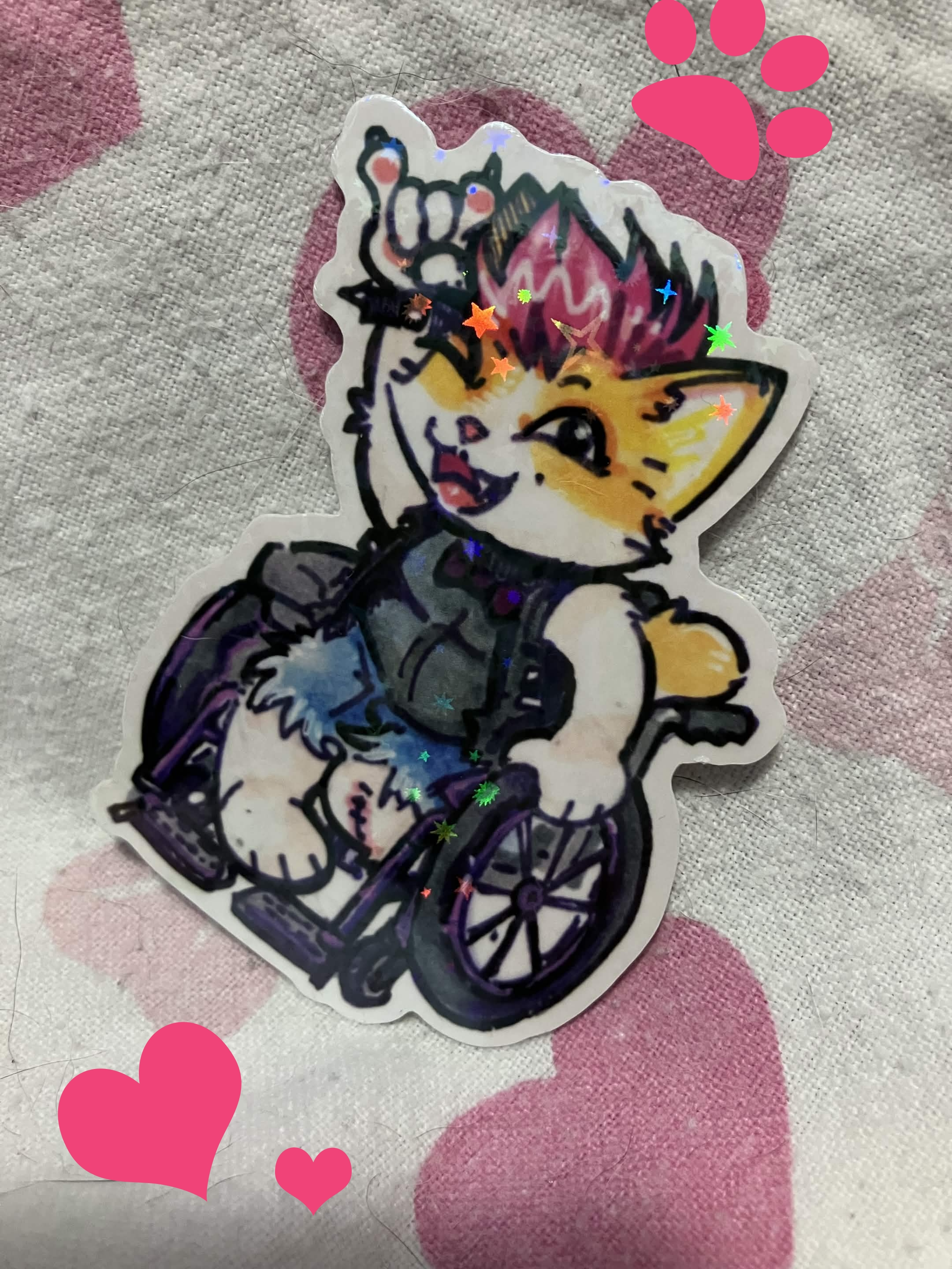 a punk catgirl with one foot amputated is riding in a wheelchair giving the horns. based off my friend borealis!!